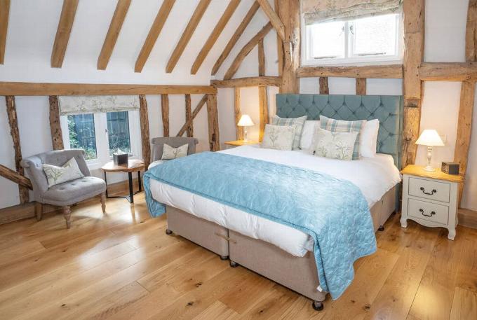 Double bed in eves of old listed building